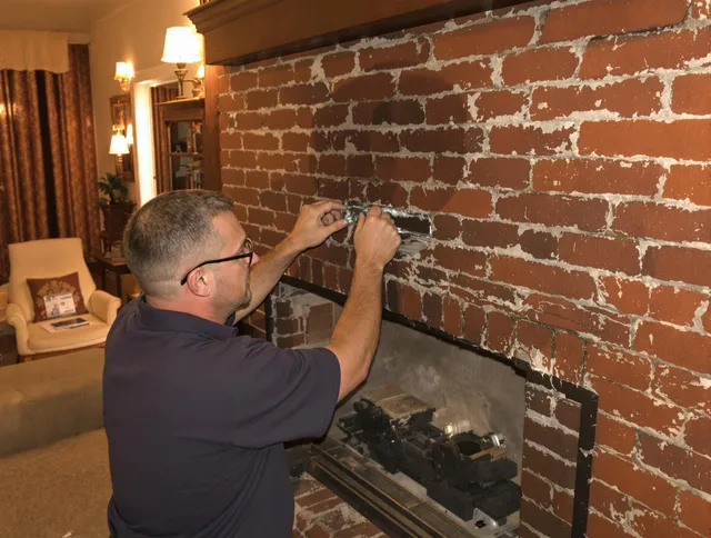 Fallbrook Chimney Sweep expert fixing a fireplace in Fallbrook, CA